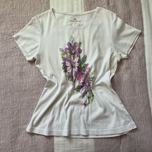 White floral tee with purple flower design.